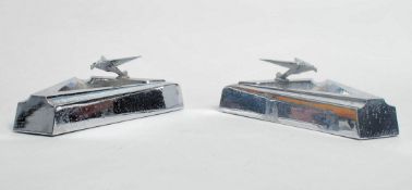 A pair of 1930's American Art Deco chrome ashtrays of angular form with eagle adorned tops. Each