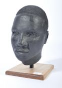 A 20th century plaster study of an African Male being well cast and constructed, set over a wooden