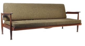A Manhattan style sofa / day bed, by Guy Rodgers, the teak frame three-seat sofa converts to a