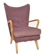 A mid century Howard Keith ' Bambino ' Chair for Jon Jansen. The armchair  being raised on shaped