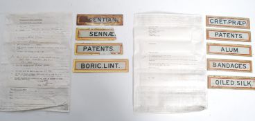 A collection of vintage early 20th glass pharmaceutical apothecary glass shelf labels to include