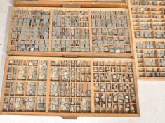 A large and impressive collection of vintage early 20th century Printers Block trays with many