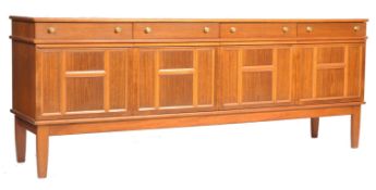A retro mid century Danish influence teak wood large ' Long John ' sideboard dresser being raised on