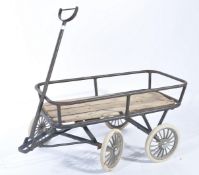 A fantastic mid 20th century childs pull along trolley / cart, constructed from a tubular metal