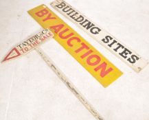 A collection of vintage wooden mid century auction advertising signs. To include a yellow and red