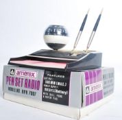 A retro 1970's original boxed ( unused ) desk top Pen Set Radio Clock combination by Amerex. The