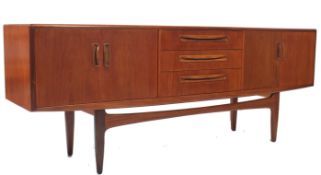 A 1970's G-Plan kelso teak wood sideboard of Danish influence having short drawers and cupboards