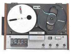 A retro 1960's teak wood cased Phillips 4 track reel to reel player model no 4308. Complete with