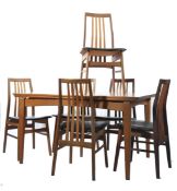 A mid century Danish teak wood dining room suite in the manner of Ejner Larsen & Axel Bender