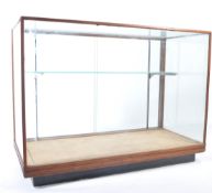 An early 20th century  Industrial Haberdashery shop display cabinet being raised on a plinth base