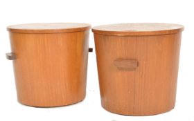 A rare pair of mid century Danish teak wood Ice buckets. Each of cylindrical form with handles to