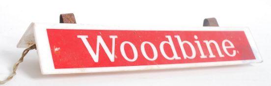 A vintage 20th century advertising point of sale sign for Woodbine's cigarettes having a white