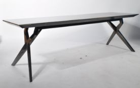 A 20th century modernist ' longjohn ' coffee - occasional table with polished mirror'd metal