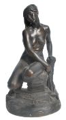 An early 20th century Art Deco plaster maquette figurine sculpture of a nude maiden set atop a