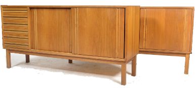 A rare pair of mid century teak wood sideboards. Each of good proportions having a bank of reeded,