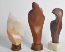 A collection of mid century scupltures by Jan Orpen sculptures in teak and alabaster. Each on