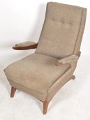 A 1960's Greaves & Thomas teak wood armchair. The base of teak wood with stunning low show wood