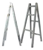 A pair of large mid century painted wooden Industrial trestles. Each in grey colourway being large