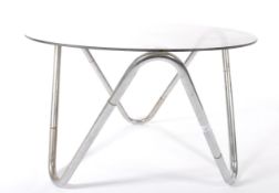 A 20th century chrome and glass coffee table, the circular glass top supported on a chrome tubular