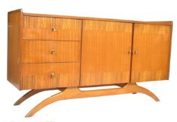 A retro mid century cross banded mahogany and walnut sideboard by Harry Lebus for Lebus Furniture.