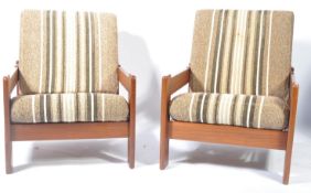 An early 1960's Guy Rogers 'Manhattan style ' teak 3 piece suite -sofa settee and armchairs possibly