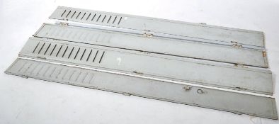 A pair of vintage mid century painted French metal bi-fold window shutters - louvre door windows.