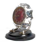 A 20th century Russian 17 jewel movement mantel clock, having faceted circular surround to Arabic