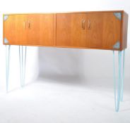 G-plan - A 1970's teak wood twin double door cabinet raised on blue powder coated hairpin legs