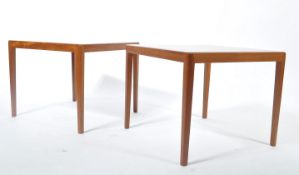 A pair of mid century Danish influence square side tables in teak wood. Each with tapering legs to