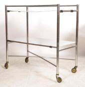 A good original mid century Industrial surgeons theatre trolley of tubular metal and stainless steel
