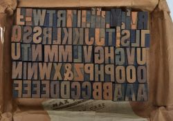 A collection of mid 20th century printers block letters and numbers contained within original box