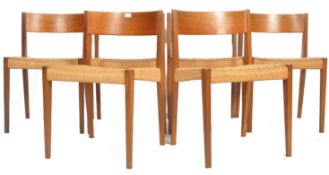 A stunning set of mid century Danish teak wood and rattan weave dining chairs in the manner of
