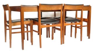 A stunning mid century large Danish extending dining table and set of 6 dining chairs. The large