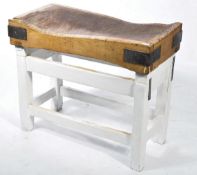 A vintage mid century heavy beech wood butchers block with metal bracket ends and of parquetry