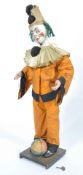 A late 19th century automaton clown in the manner of Adolphe Muller. The freestanding clown set on