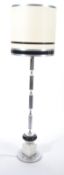 A retro style 20th century chrome and dice style standard lamp. Raised on terraced base with
