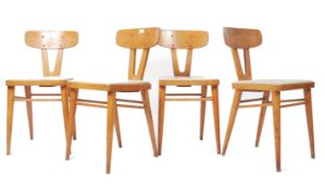 A set of 4 mid century retro dining chairs having