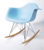 After Charles & Ray Eames - RAR rocking chair with a moulded baby blue seat, steel wire struts and