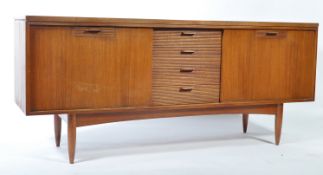 A vintage / retro 1960's Greaves & Thomas teak wood sideboard with a central bank of drawers flanked
