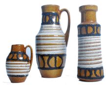 A group of three vintage retro mid 20th century West German ceramic vases of graduating form in a