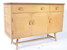 A 1950's mid century Ercol ' Windsor ' pattern beech and elm sideboard having two drawers above