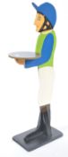 A 20th century wooden painted dumb waiter in the form of a horse jockey being of wooden construction