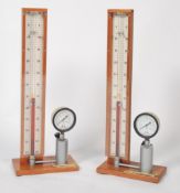A pair of  tall Industrial mid century gauges being designed to test gas having central phials