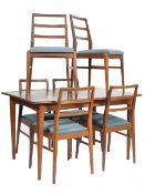 A stunning mid century Robert Heritage for Archie Shine teal wood extending dining table and set