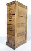 A good early 20th century Industrial oak upright pedestal 4 drawer filing cabinet having plinth base