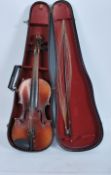 An early 20th century violin with paper label to interior reading Antonius Stradiuarius