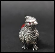 A 925 silver Victorian style pincushion in the form of a pheasant with red velvet cushion. Marked