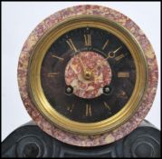 A 19th century French rouge marble barrel clock by Jean-Baptiste Delettrez. The 8 day movement