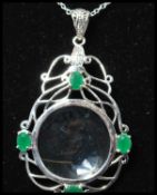 A 925 silver Art Nouveau style pendant necklace strung with an ornate magnifying glass set with
