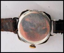 A vintage early 20th century Rolex 1917 trench military interest watch having a silvered dial Arabic